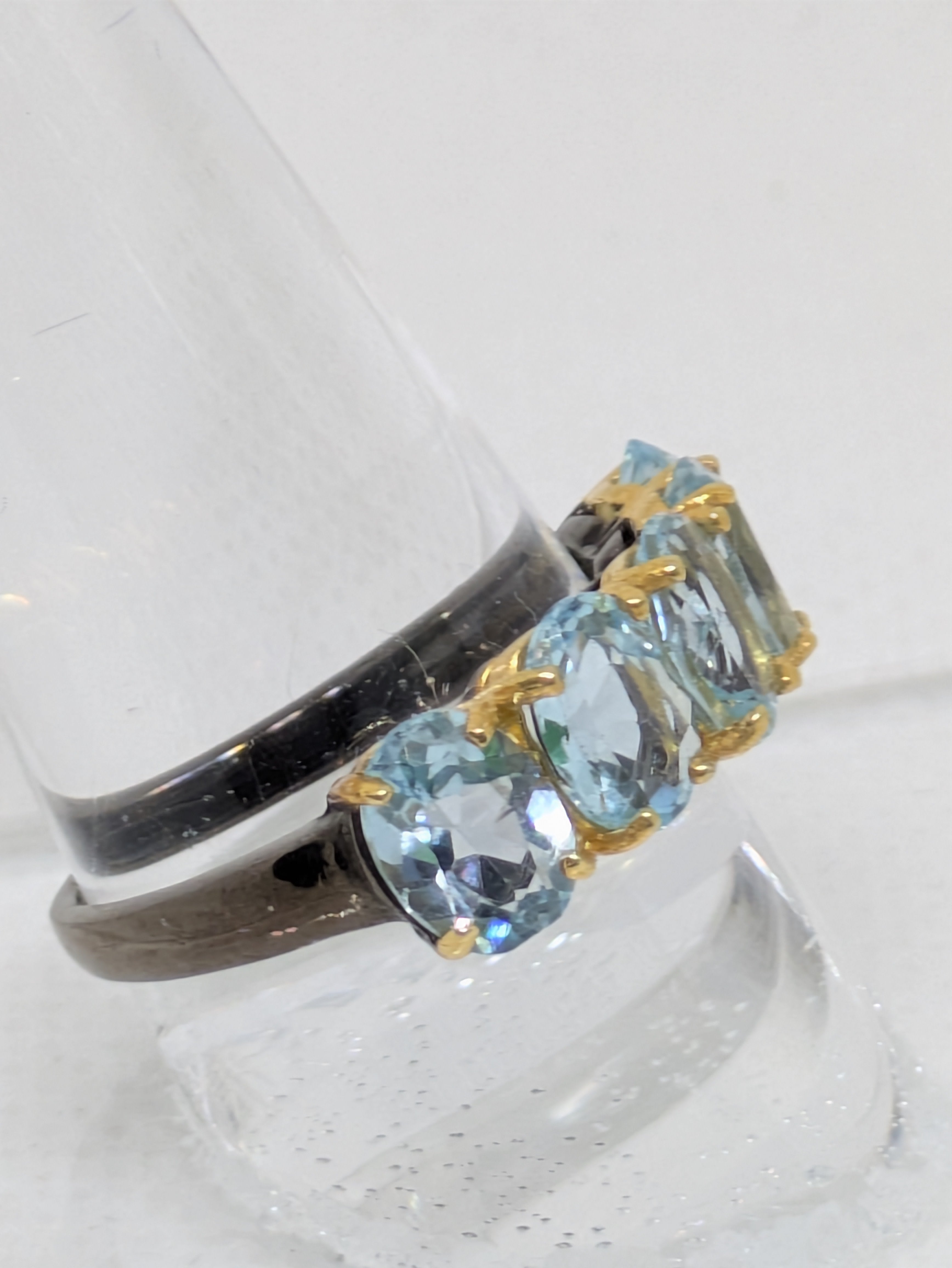 5.5 Carats Natural Blue Topaz Ring with black rhodium banding