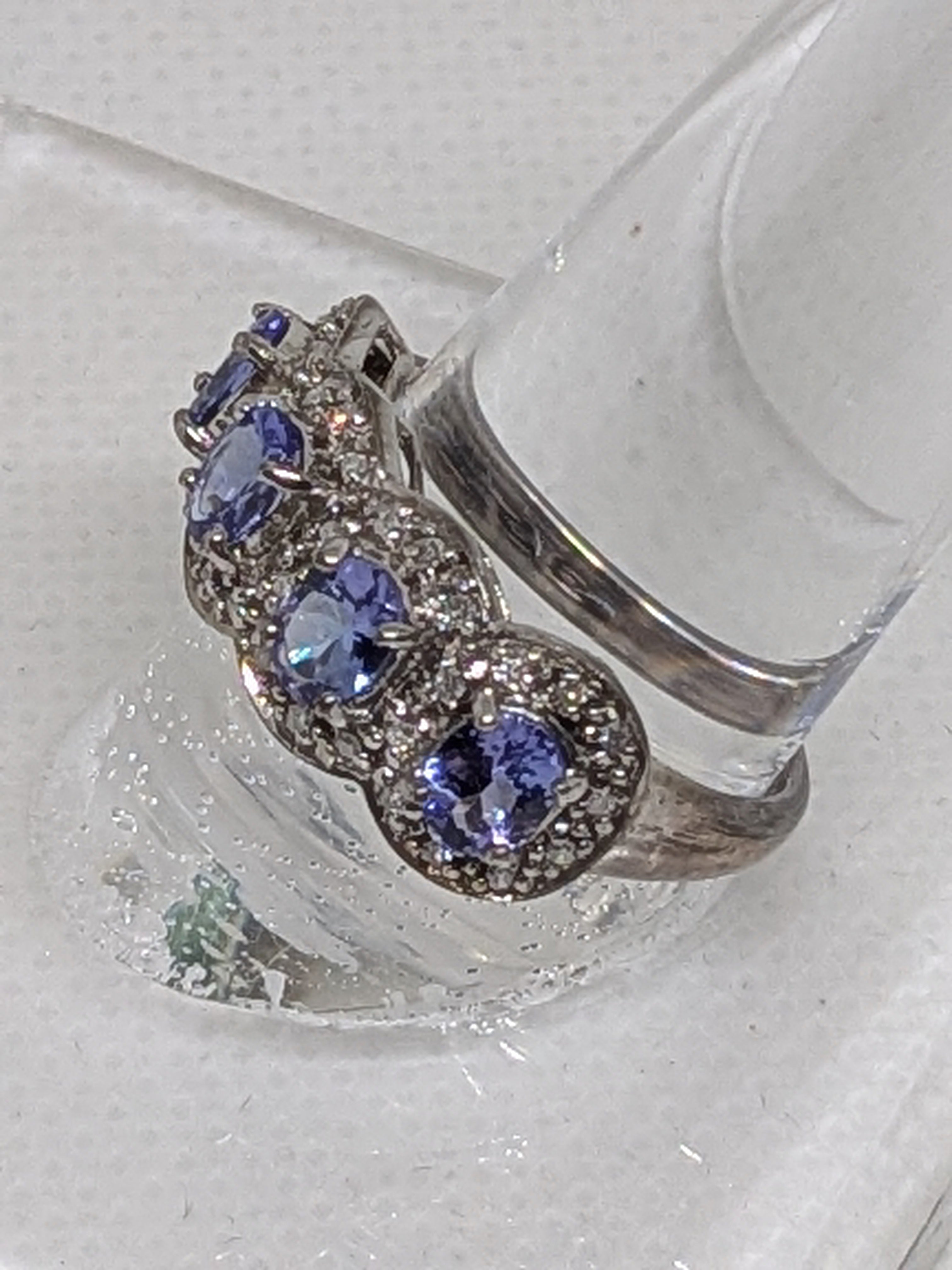 1.11 Carat Natural Tanzanite & Diamond Anniversary Ring